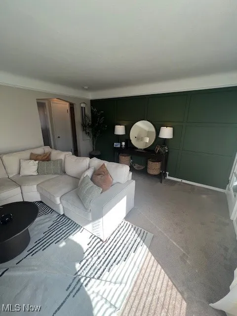 Living area featuring carpet flooring