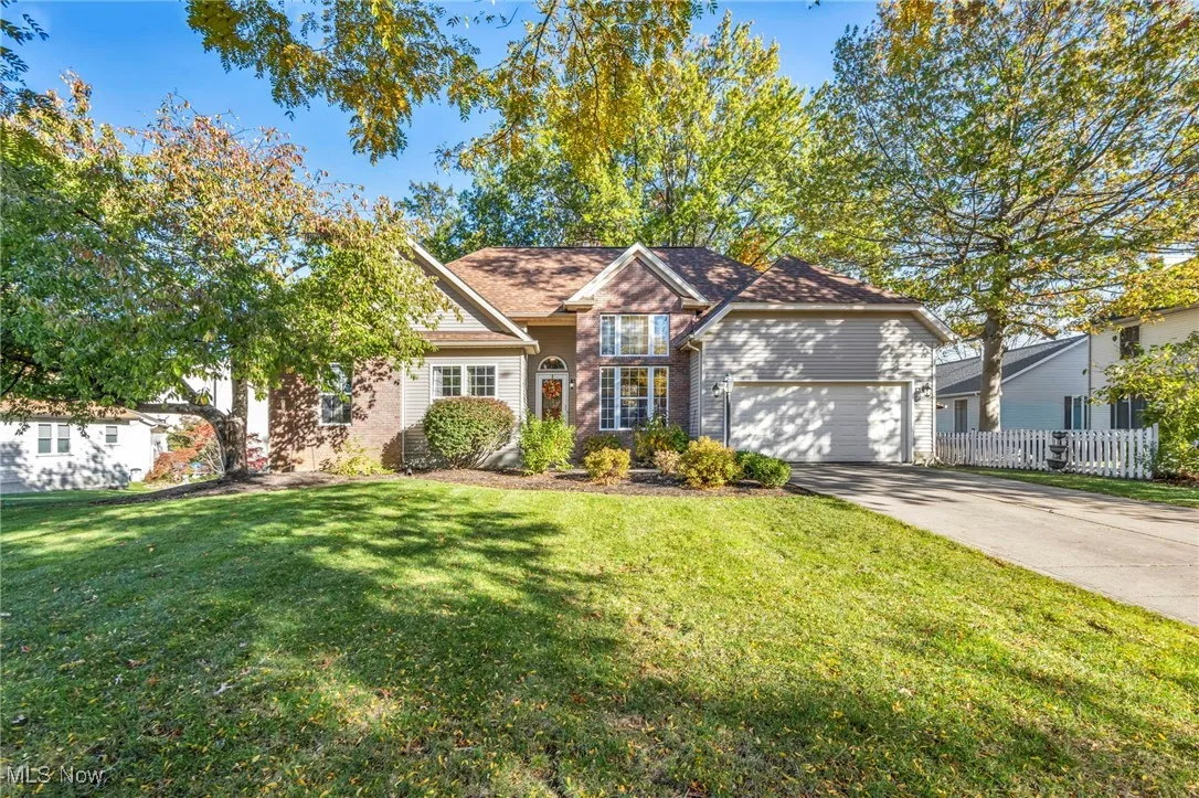 View of front of house featuring driveway and an attached garage