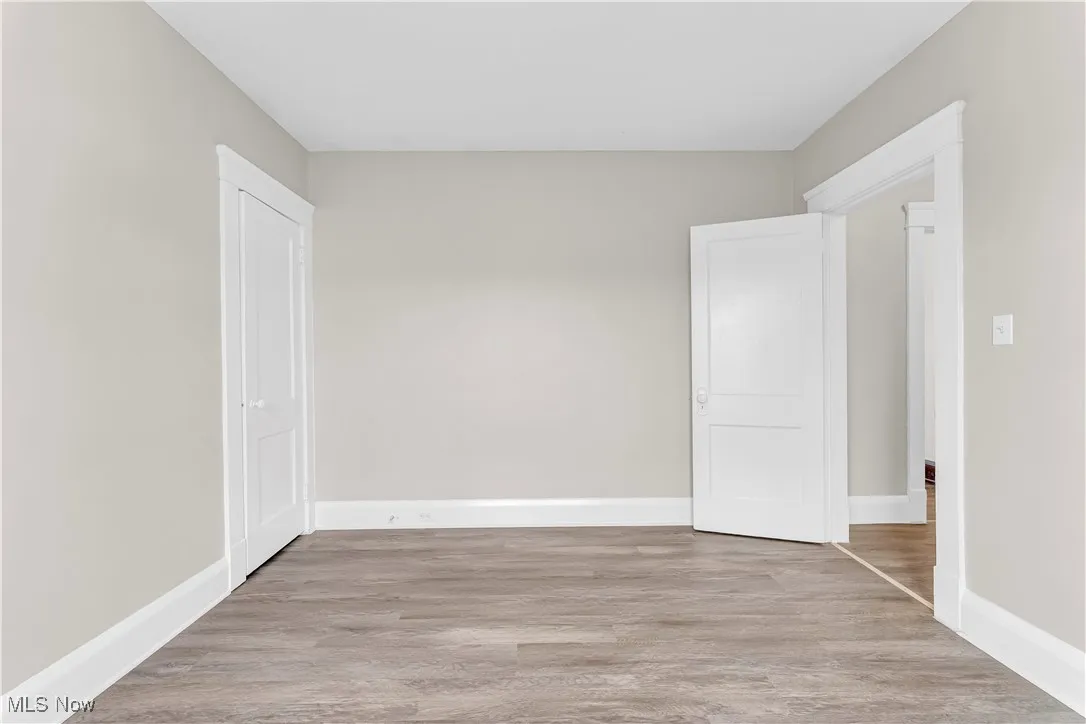 Empty room featuring light wood-style flooring
