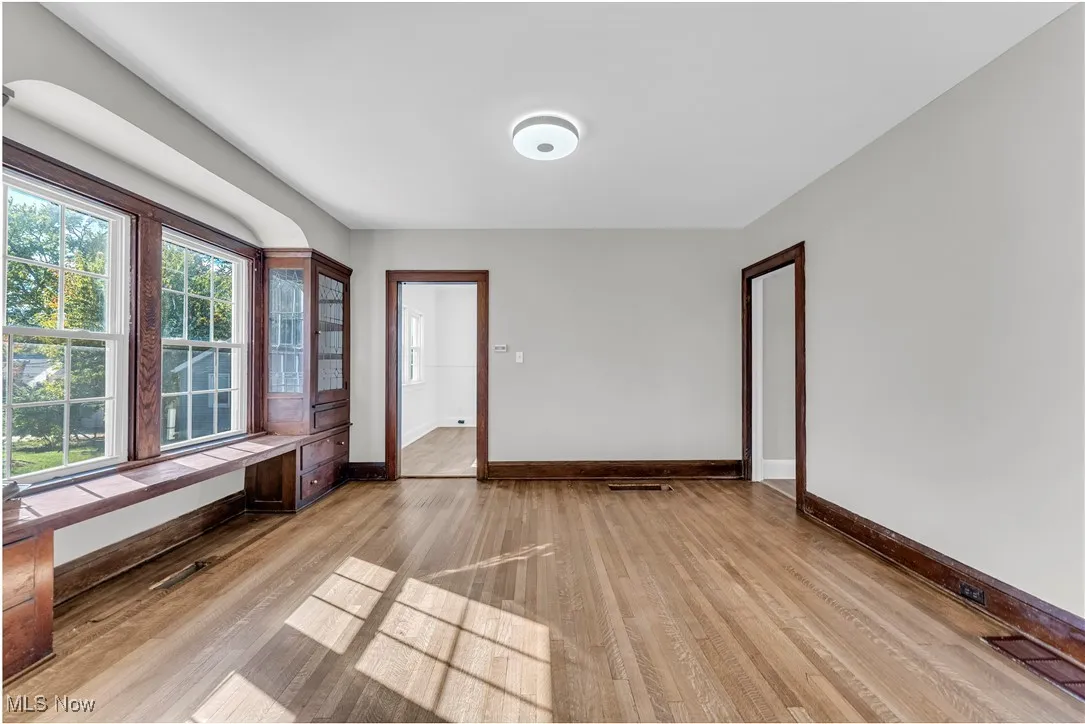 Empty room featuring light wood-type flooring