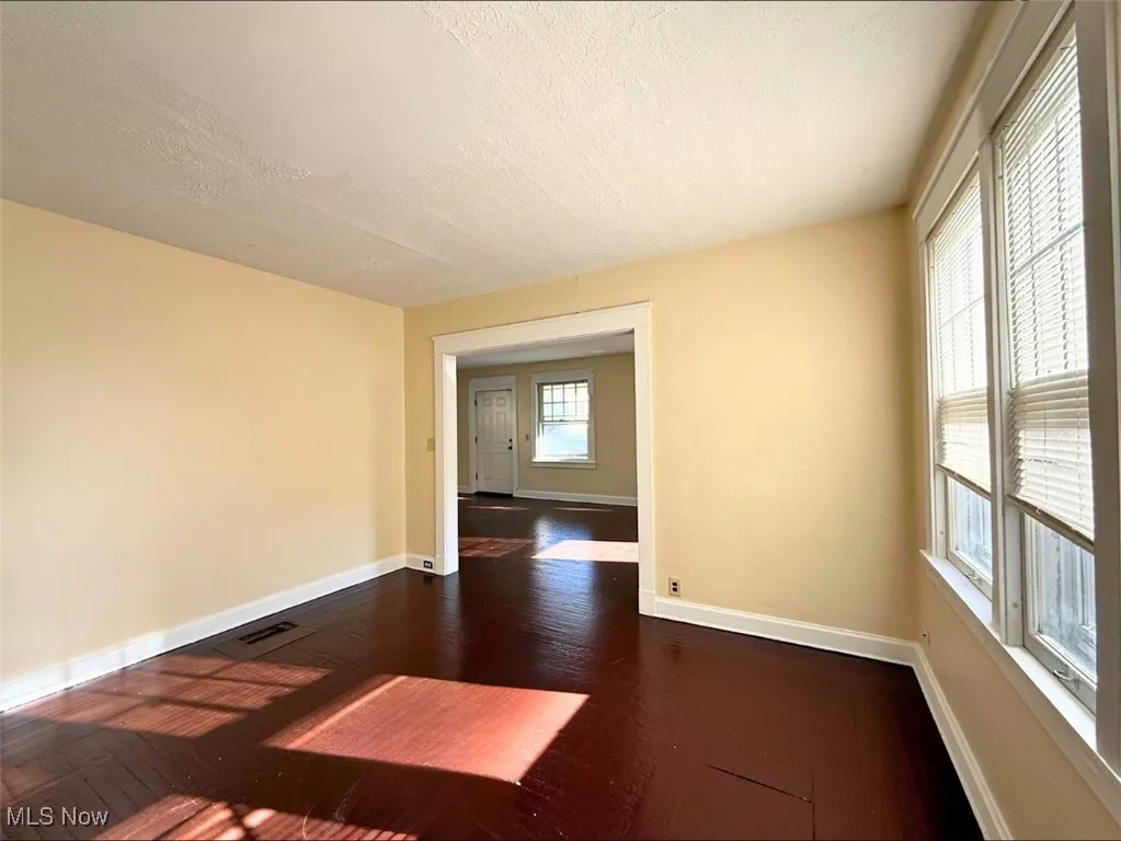 FH-DINING room featuring dark wood-style floors and a textured ceiling