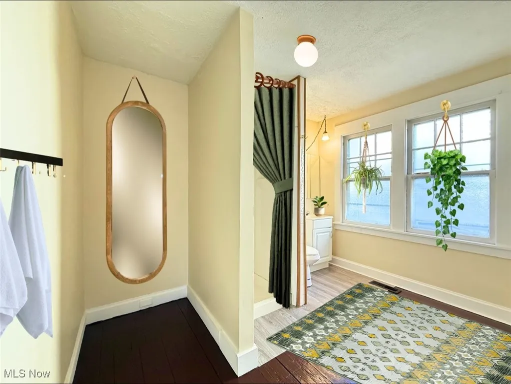 FH-E-STAGED-1ST FL FULL BATH with wood finished floors