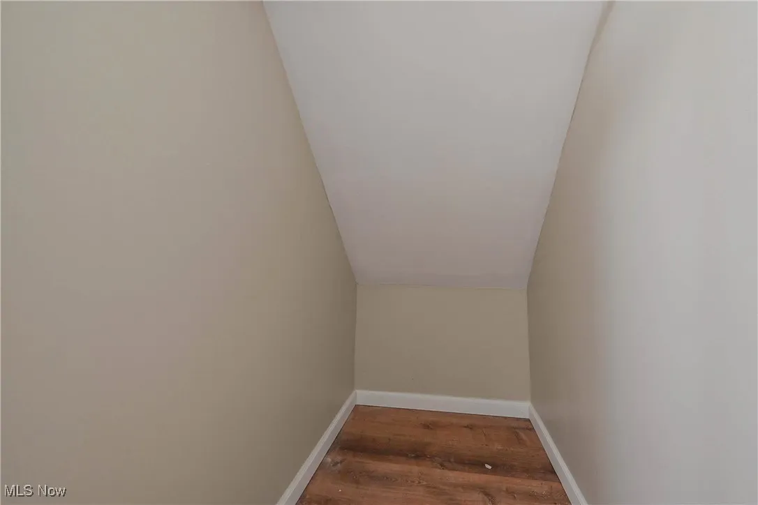 Detailed view of wood finished floors and baseboards