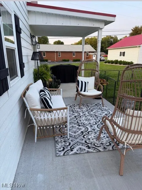 View of patio featuring an outdoor hangout area