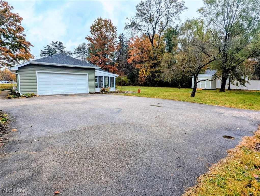 Garage featuring driveway