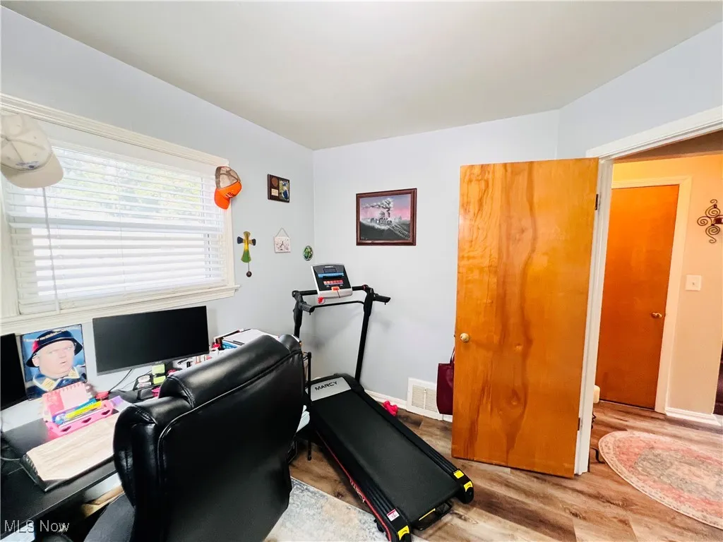 Office area featuring light wood finished floors and baseboards