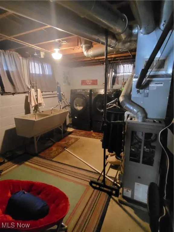 Basement with heating unit and a sink