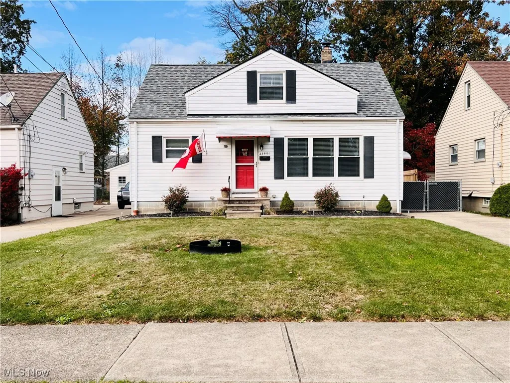 Bungalow featuring roof with shingles, a front lawn, and a chimney