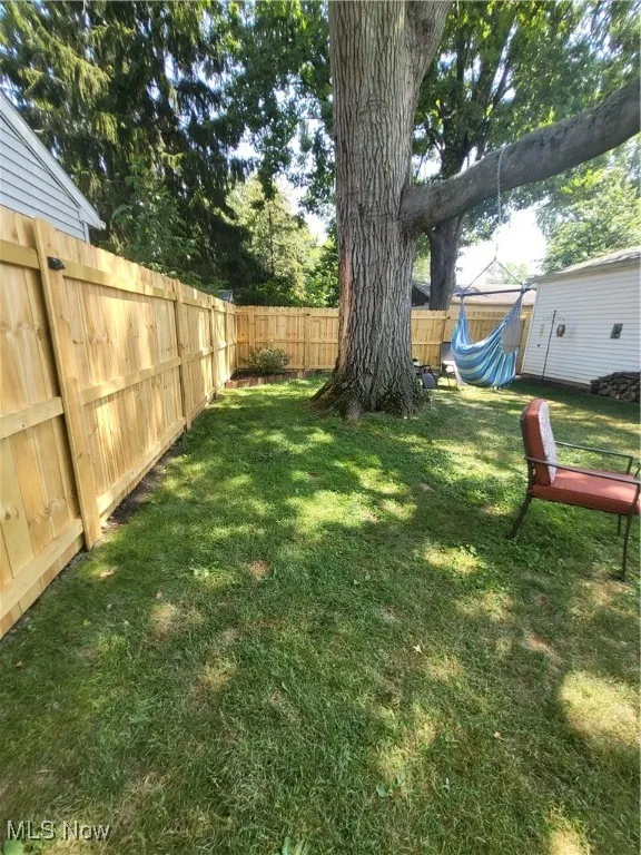 View of fenced backyard