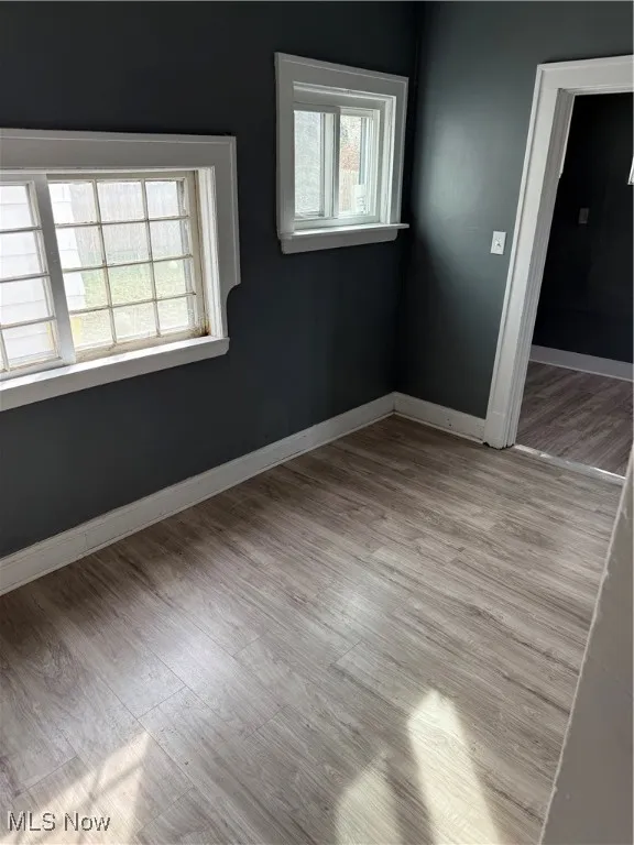 Empty room with light wood-style flooring