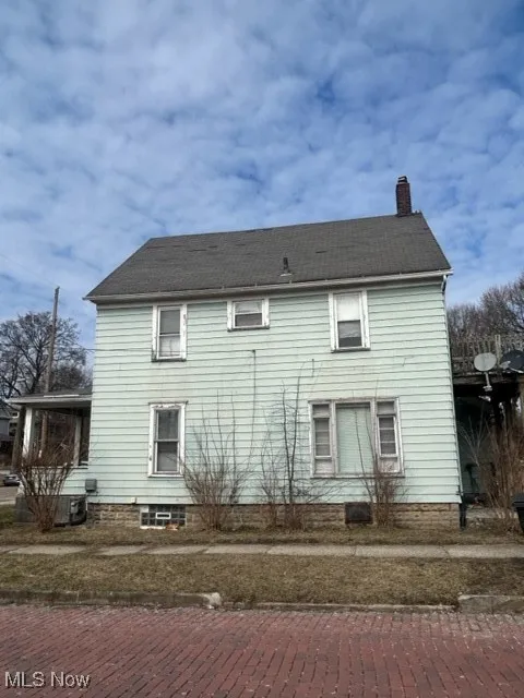 Rear view of house with a chimney