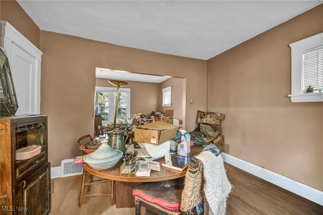 Dining area with wood finished floors and a textured ceiling