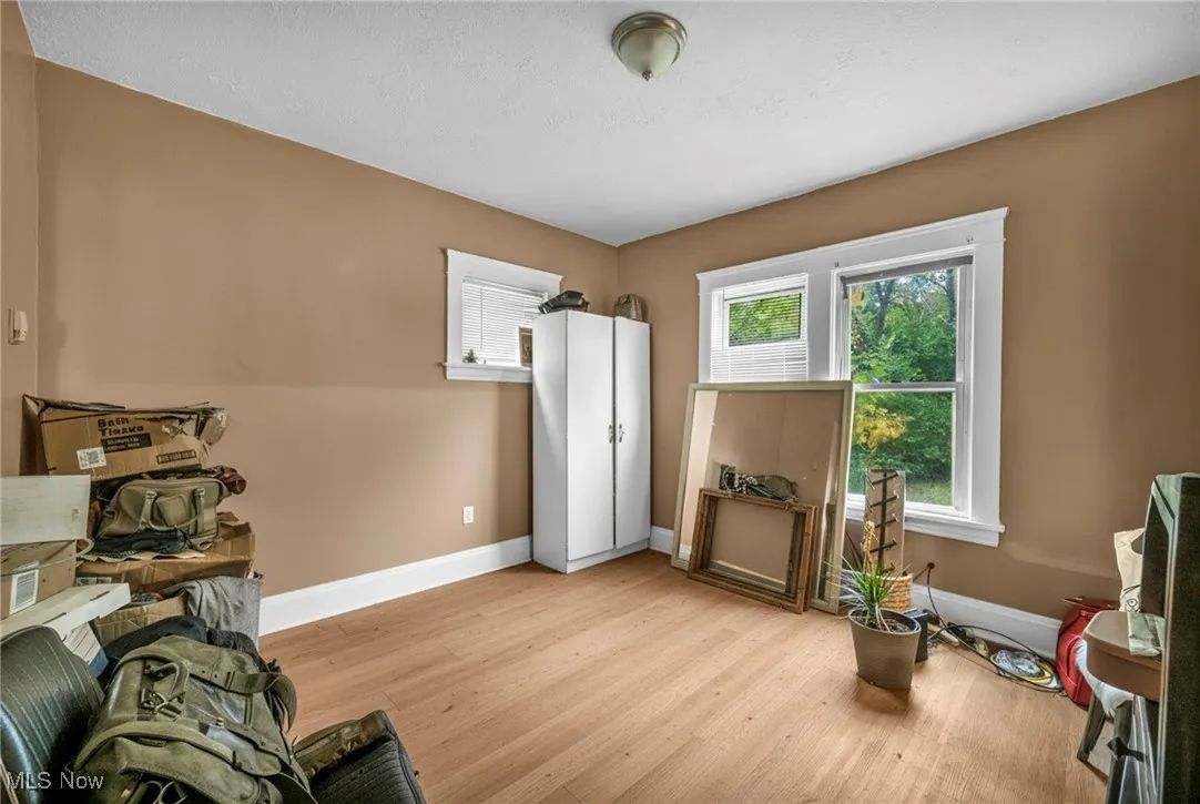 Living area featuring wood finished floors and baseboards