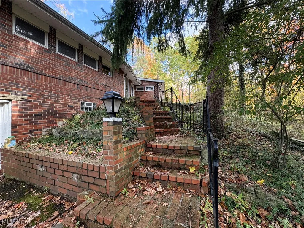 View of yard featuring stairway