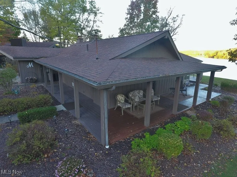 Wrap around covered deck leads to the massive front deck