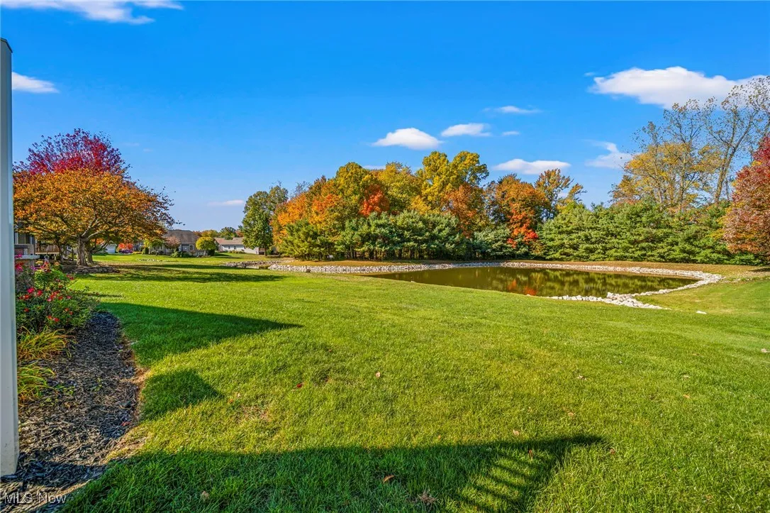 View of lawn featuring a water view