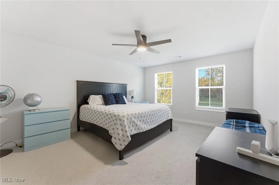 Bedroom with carpet flooring and a ceiling fan