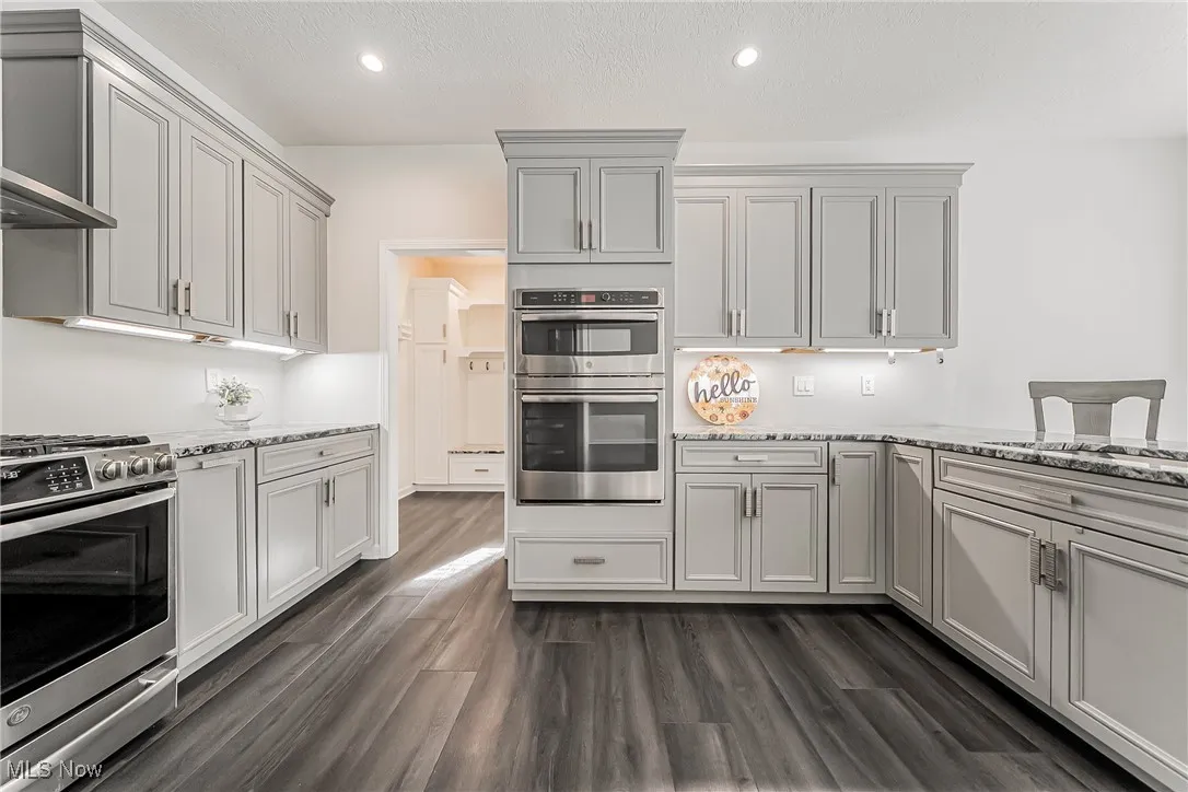 Kitchen view to mudroom/garage entrance and laundry room.