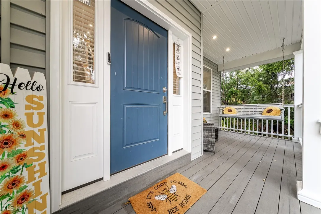 Doorway to property with covered porch welcomes you