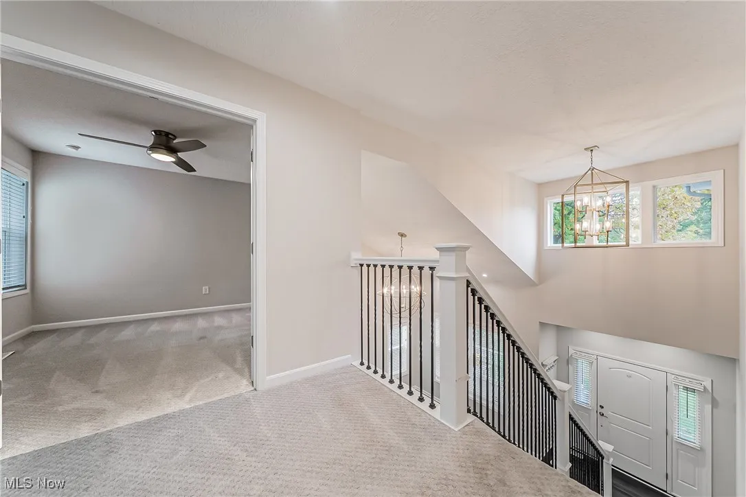 2nd floor views from upstairs landing to bonus room, and front entry featuring