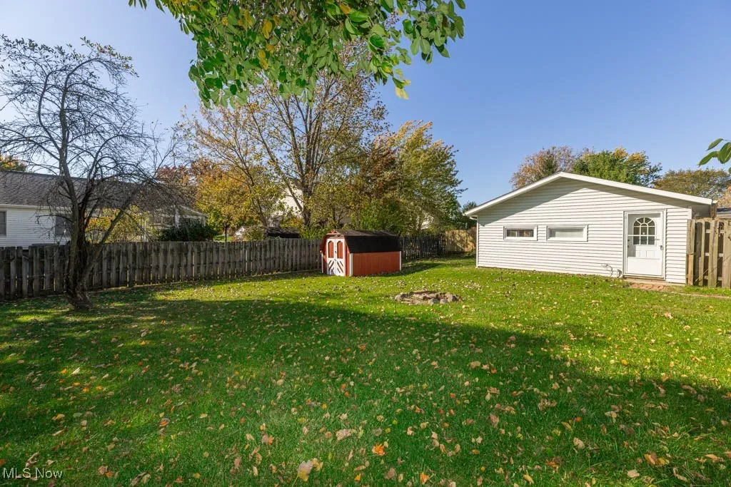 Fenced backyard with a shed