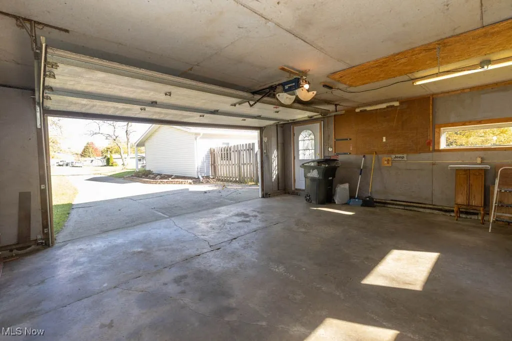Garage featuring a garage door opener