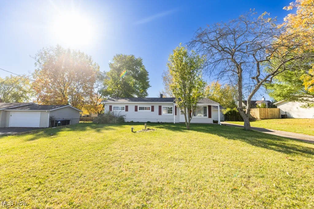 Ranch-style house featuring a detached garage