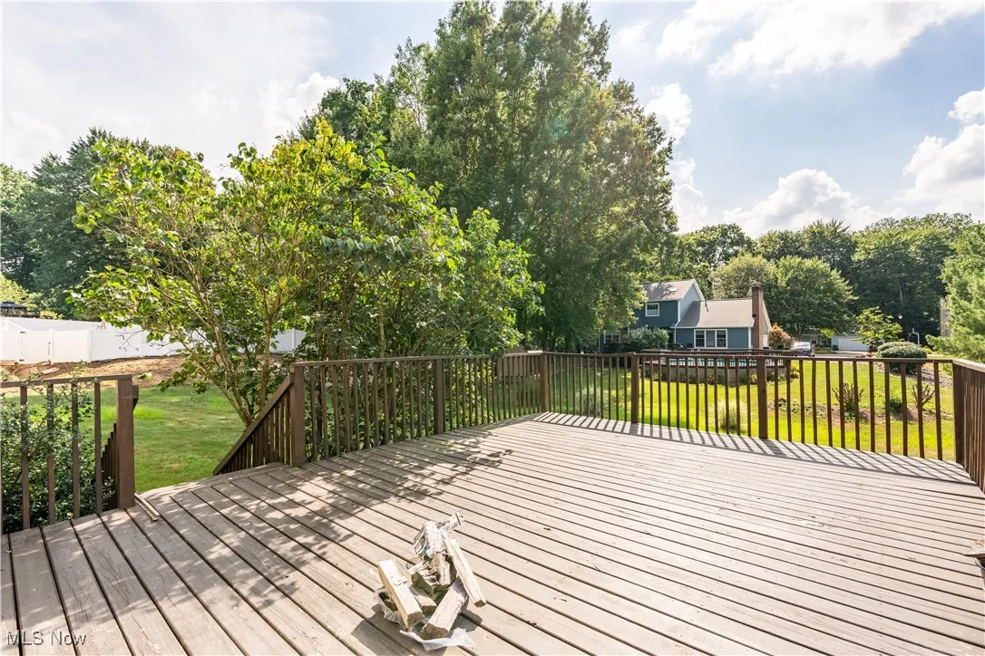 Wooden deck featuring a yard