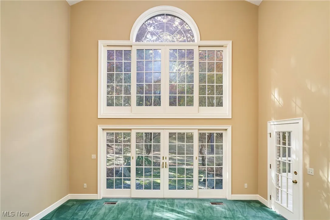 Stunning Great Room door/window leading to stone patio and backyard