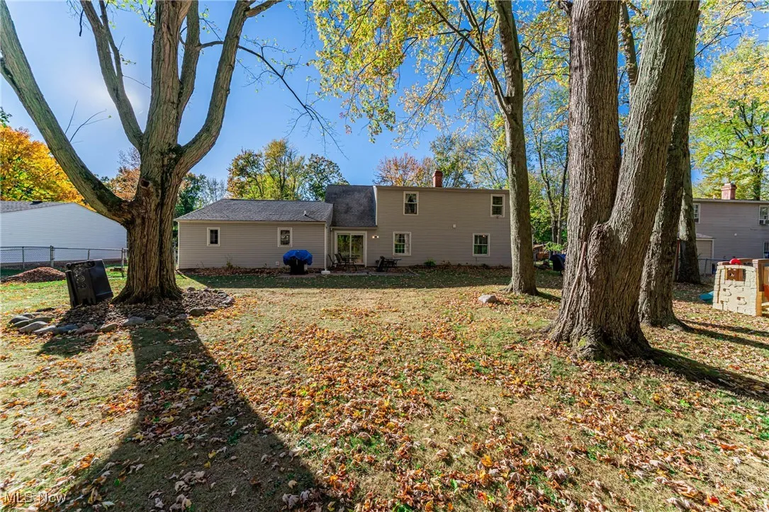 Rear view of property featuring a patio and a chimney
