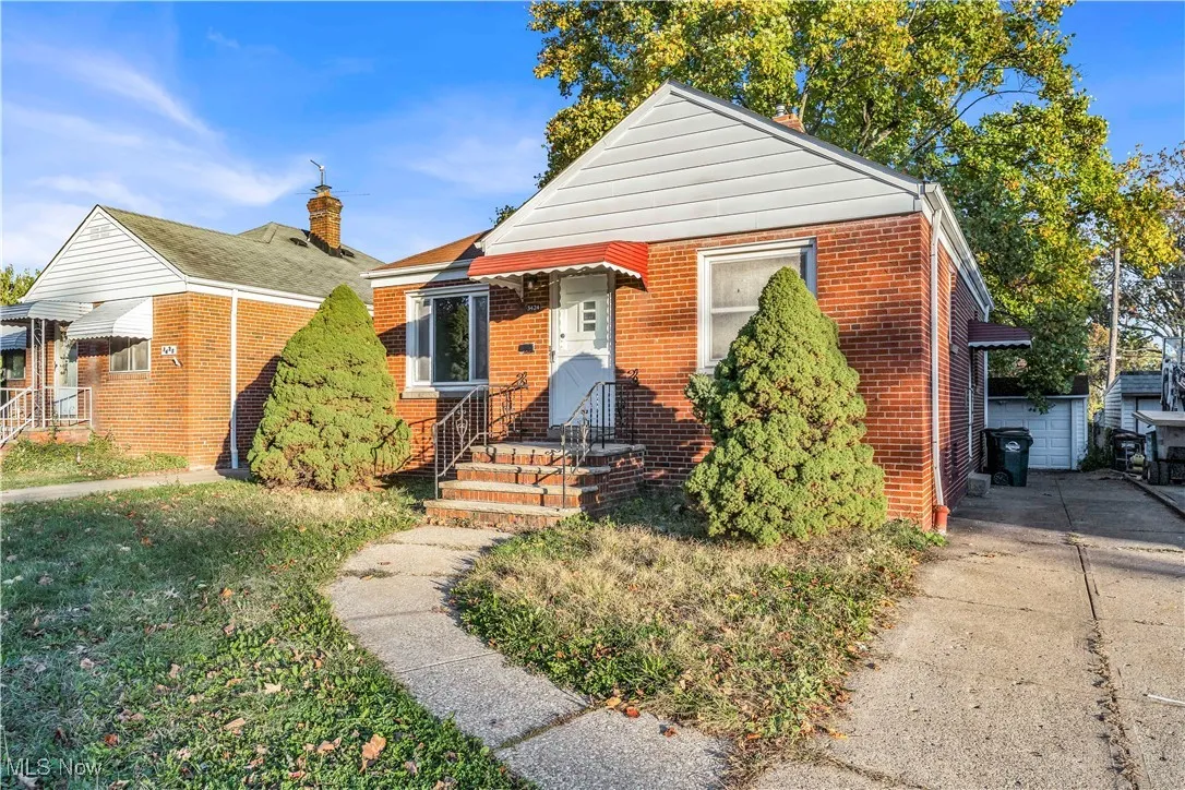 Bungalow-style house featuring brick siding