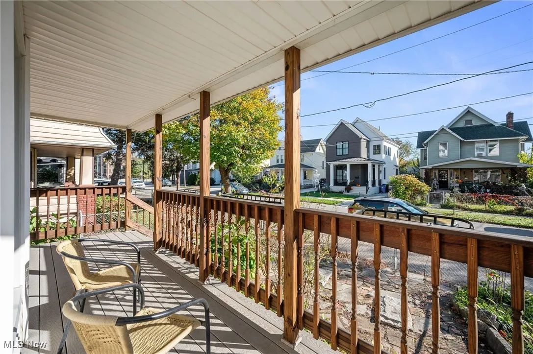 Wooden porch featuring a residential view