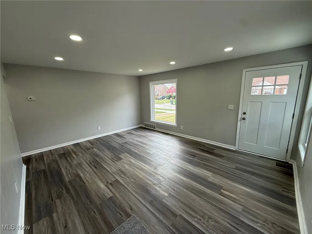 Entryway featuring recessed lighting and dark wood-type flooring