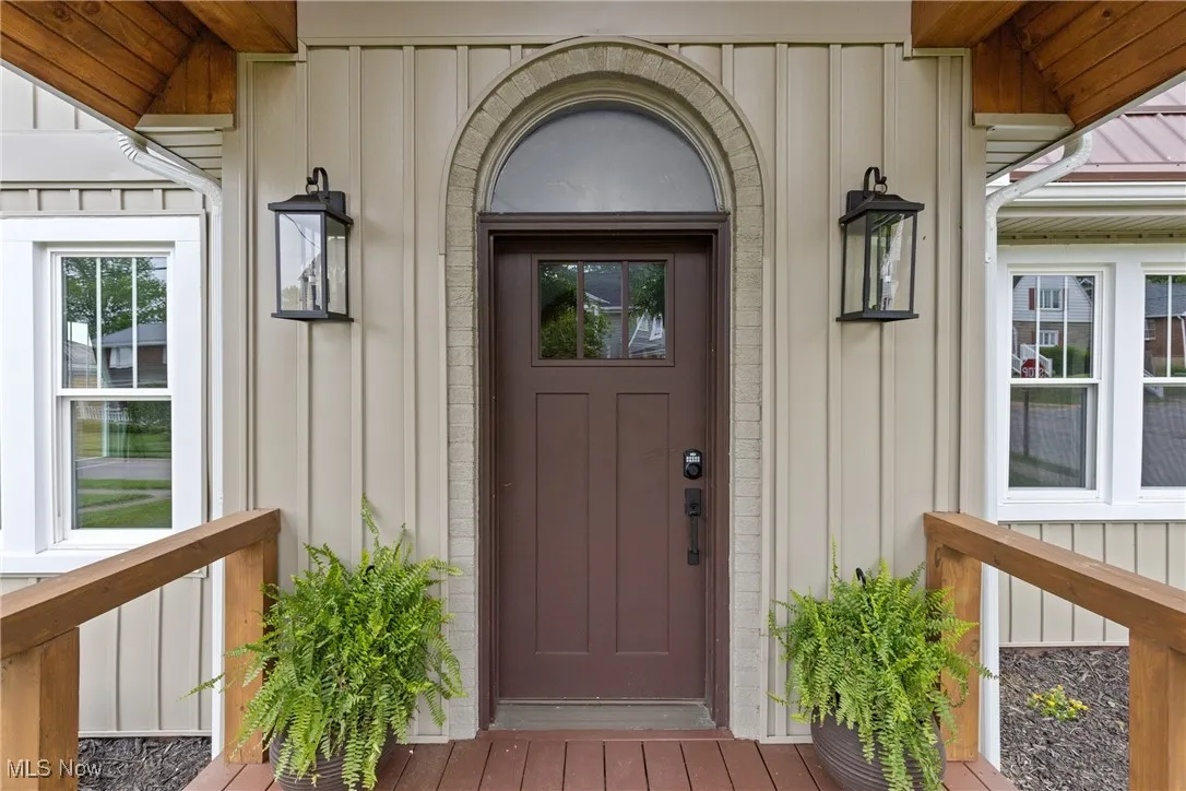 Property entrance with board and batten siding