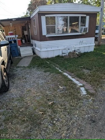 View of home's exterior featuring a lawn