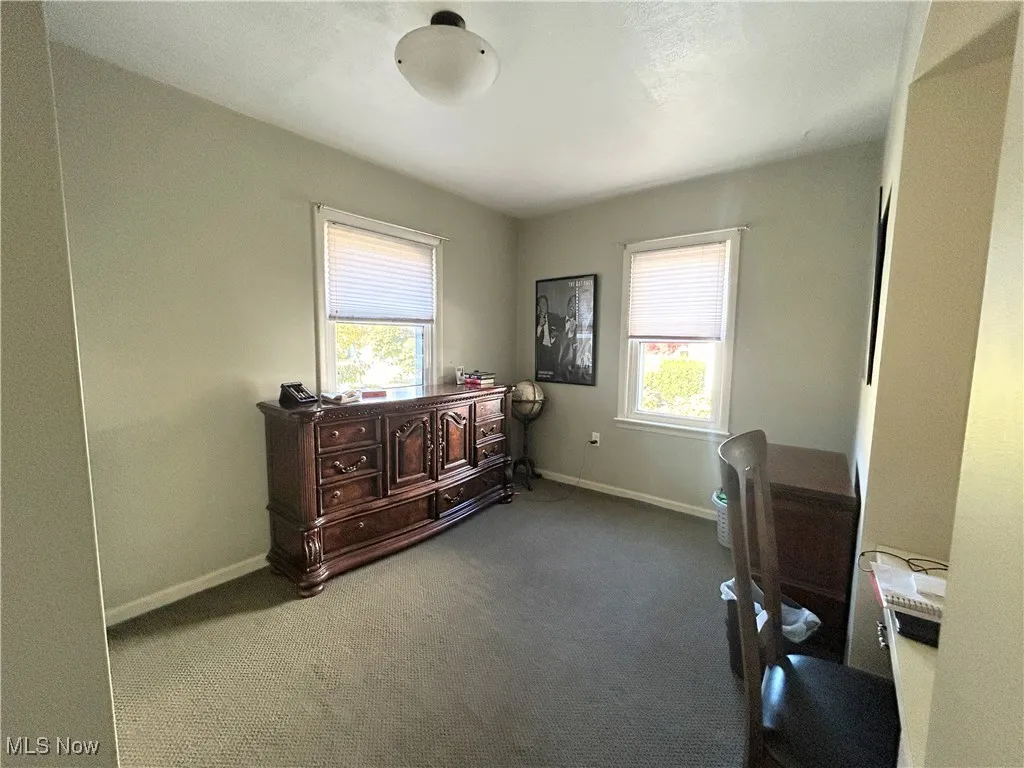 Carpeted bedroom first floor featuring baseboards