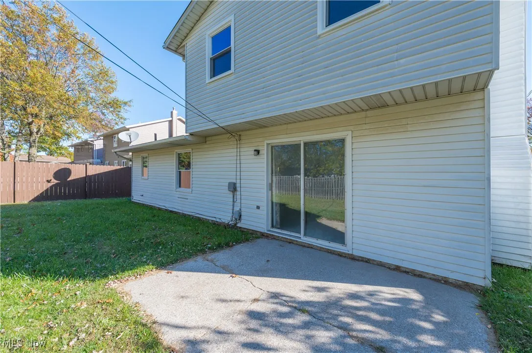 Back of house with a patio
