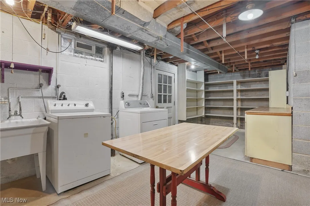 Unfinished basement with washing machine and dryer