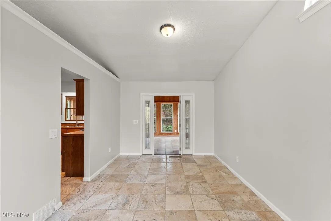 Dining area with tile floors and a textured ceiling