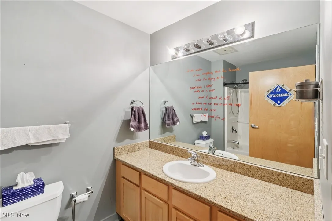 Full bathroom with vanity and shower / tub combo