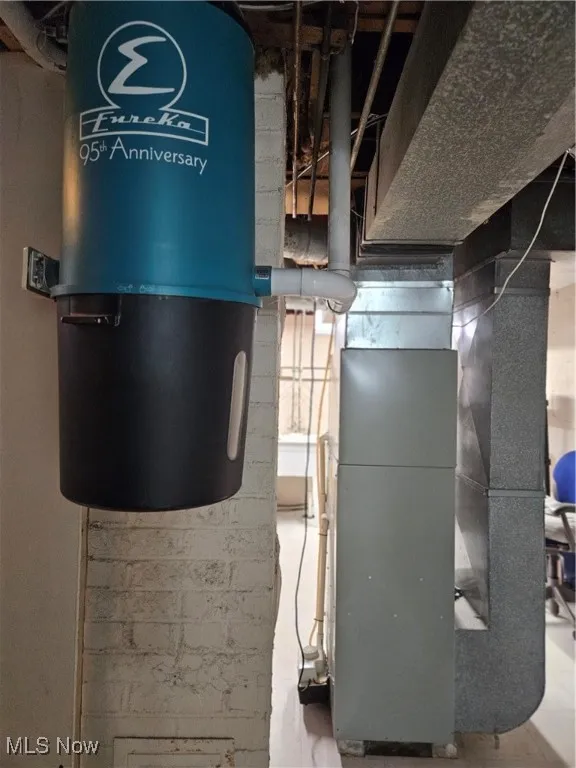 Utility room with a central vacuum unit