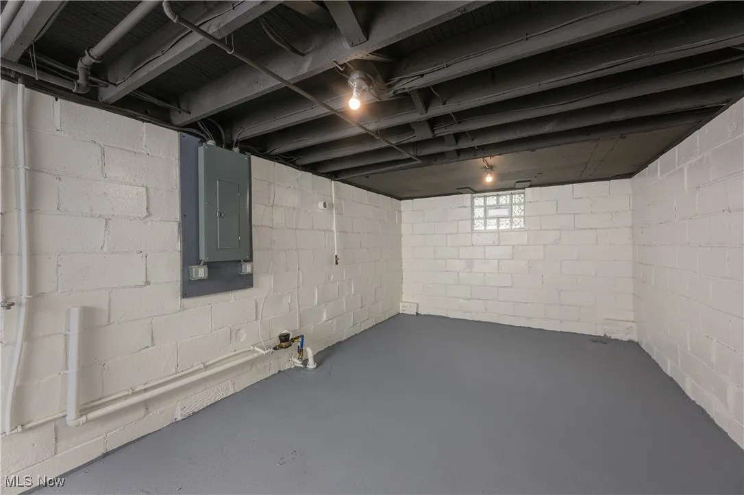 Below grade area featuring electric panel