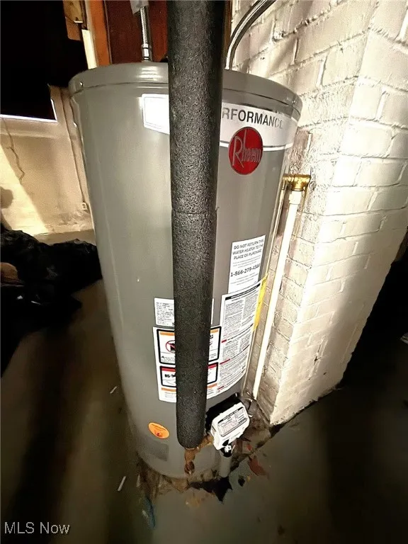 Utility room featuring gas water heater