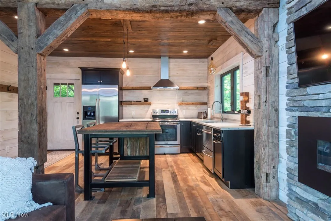 Rustic charm meets modern function in this warm, inviting kitchen.