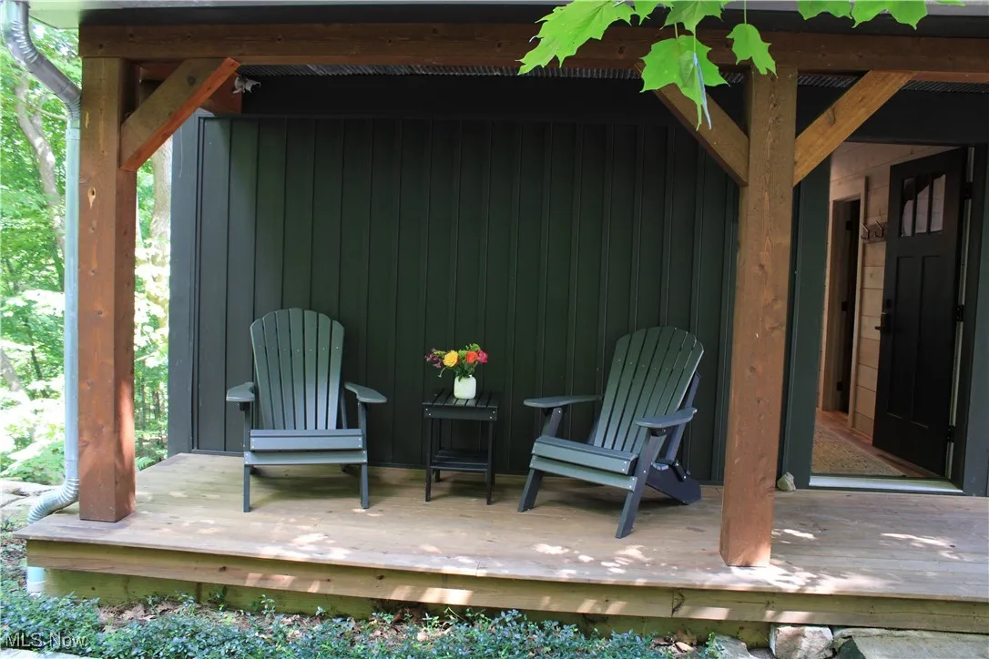 Woodland retreat begins on this front porch.