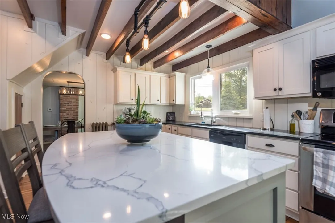 Finely polished granite countertops, creating a sophisticated and luxurious feel in a kitchen.