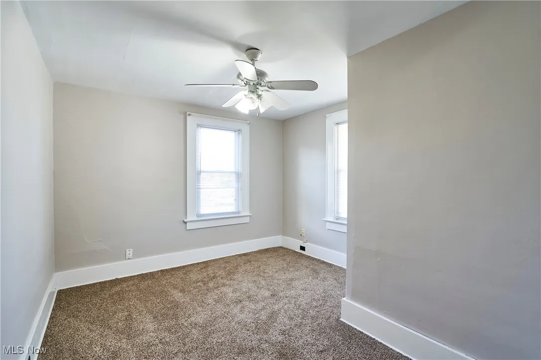 Bedroom with carpet and ceiling fan