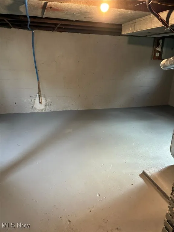 Unfinished below grade area with electric panel