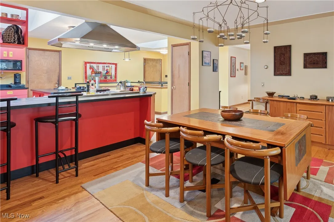 View from the dining room to the kitchen and the entrance foyer beyond