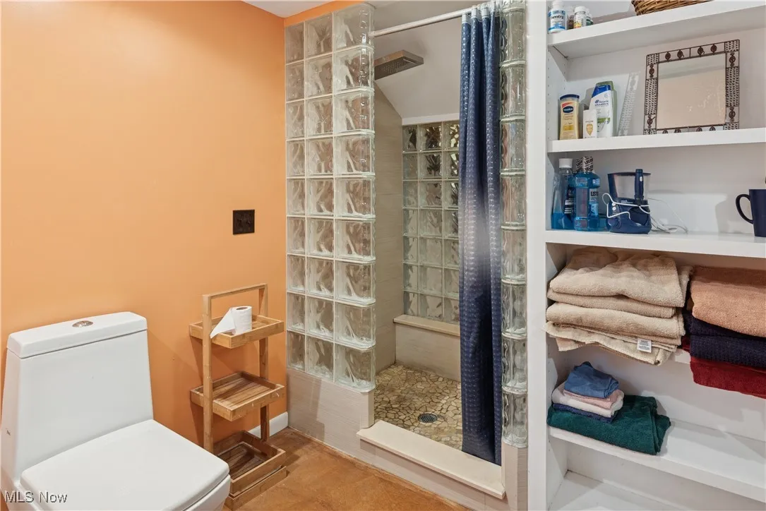 Updated bath with shower shared by the bedrooms and family room on the lower level.